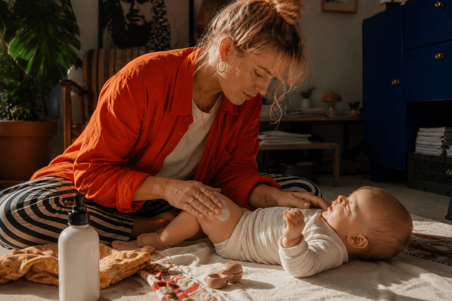 Applying moisturiser to a newborn