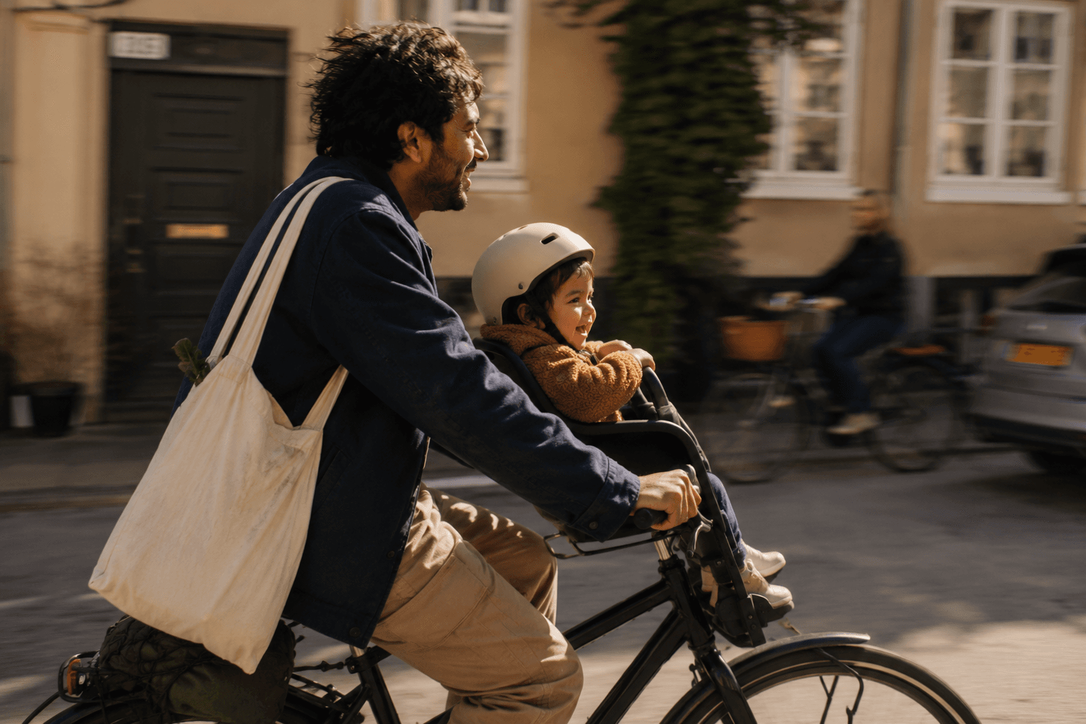 Father biking with toddler, out in the world